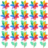 Jucoan rainbow pinwheels in a yard providing vibrant outdoor decor that moves with the breeze