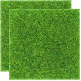 KAEZDD artificial grass squares 12x12 on tabletop for DIY crafts and décor.