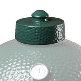 Kamaster ceramic grill top on a Big Green Egg provides precise fit for even heat distribution.