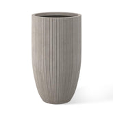 Kante 24-inch round concrete planter with textured finish for modern indoor or outdoor display.