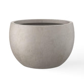 Kante round concrete planter with 15.7-inch diameter for bold plant displays.