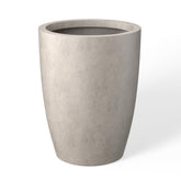 kante tall round concrete planter with weathered finish enhances indoor and outdoor spaces