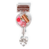 Kikkerland Solar Powered Rainbow Maker on a sunny window, creating vibrant light patterns.