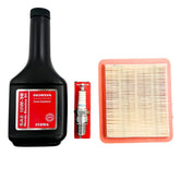 Kindza Tune-Up Kit oil bottle pour showing easy top‑ups for smoother starts