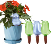 KIROYAL 4-pack self-watering spikes in green and blue hydrates potted plants.