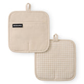 KitchenAid Gridlines pot holder pack in milkshake tan with heat protection up to 600°F.