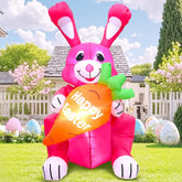 KOOY 4ft Easter Bunny inflatable in pink holding a carrot for eye-catching yard display.