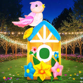 KOOY 5ft spring inflatable bird house with LED lights for yard illumination.