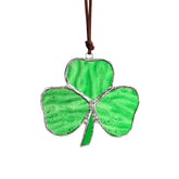 KRISININE shamrock suncatcher with rope hanging to reflect sunlight and color.