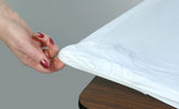 Kwik-Covers 6ft rectangle table cover in white on table for quick setup.