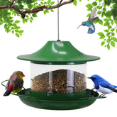 LAbyrent Hanging Bird Feeder outdoors with roof draws birds while blending with garden foliage.
