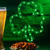 LAMPHOME shamrock window silhouette glows green for St. Patrick's Day decor.