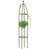 LeJoy Garden tall bronze obelisk trellis supports climbing vines.