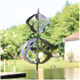 LimeHill wind spinner in silver decorates the yard with kinetic motion.