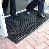 Lovinland large rubber doormat with outdoor hex holes for scraping dirt and reducing slip risk.