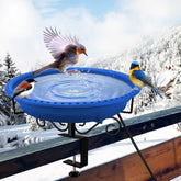 Lovppy heated bird bath mounted on a deck railing with flowing water in winter.