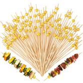 LOYIM 100-pack 6-inch gold pearl cocktail picks for elegant appetizers and desserts.