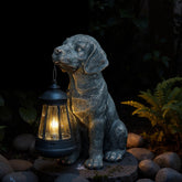 Lyeasw solar dog statue with lantern lighting the garden at dusk