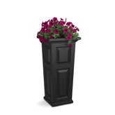 Mayne Nantucket 32-inch tall planter with self-watering system brightens sunlit patio.