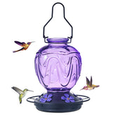 MCHBF Glass Hummingbird Feeder with red jar attracts hummingbirds outdoors