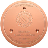 Mellbree Bird Bath Copper Disc resting in a stone basin for clearer water.