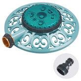 Melnor Sprout 8-pattern sprinkler with a sturdy metal base watering a garden bed.