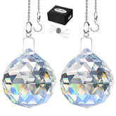 MerryNine crystal ball prism closeup catching sunlight to cast rainbow reflections.