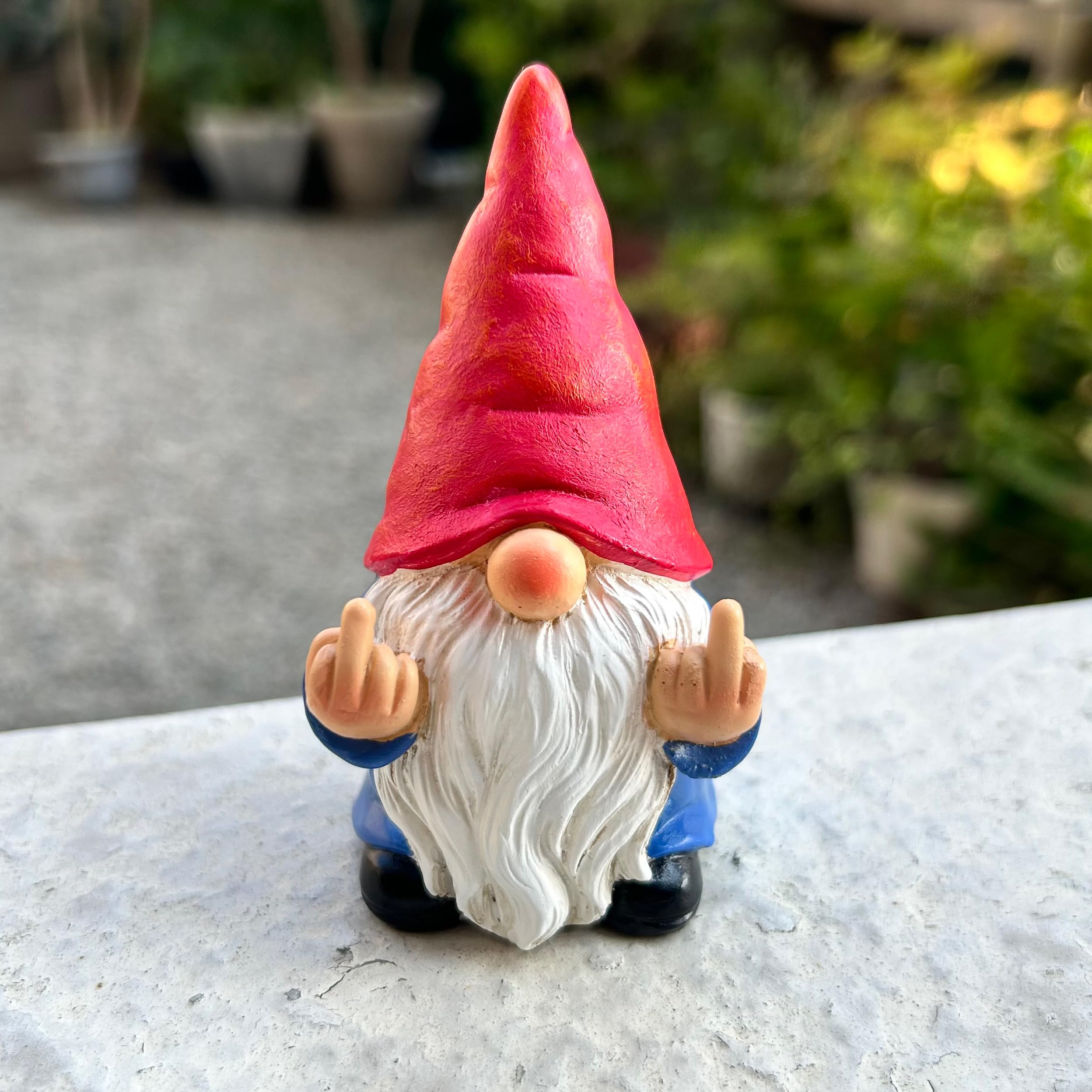 Middle Finger Gnome Mini 3.5in adds cheeky charm to outdoor decor.