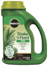 Miracle-Gro Shake 'N Feed palm plant food bottle ready for simple garden feeding