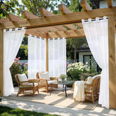 MIULEE white outdoor curtain panel with grommet top enhances patio setup.