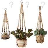 Mkono macrame hanger 35 inch on wall displays plant with stylish warmth.