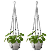 Mkono macrame plant hanger with wood beads adds vintage charm, elevating decor.