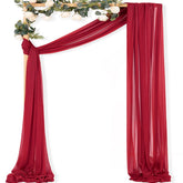 MLMC red wedding arch draping panel close-up showing wrinkle-resistant gauze with subtle micro-glitter.