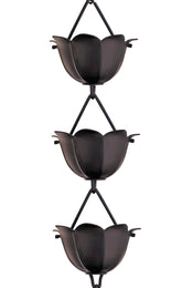 Monarch Rain Chains Aluminum Lotus Cups Black 8.5 ft enhances curb appeal with a sleek, calming water display.