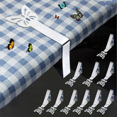 MONNCHA butterfly-tablecloth-clip securing a tablecloth on a windy patio