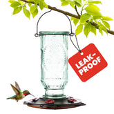 More Birds Vintage Glass Hummingbird Feeder with antique finish enhances backyard feeding.