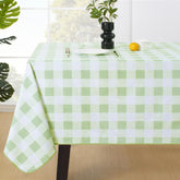 MOSAYT buffalo gingham tablecloth in sage green protects surfaces during outdoor meals.