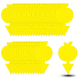 Mosqueda apple-shaped fruit fly trap in a plant pot attracts pests with bright yellow color