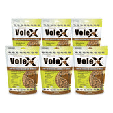 MouseX VoleX pellets being applied to lawn soil for vole control