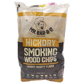 Mr. Bar-B-Q Hickory chips bag on grill for authentic smoky flavor.