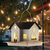 Mrcrafts Solar Bird Feeder hangs in a garden with a durable metal design attracting birds