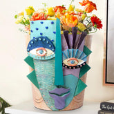 Mrlikale abstract face planter adds vibrant color to desks and shelves.