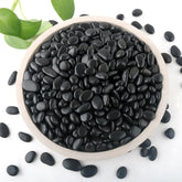 Mulctun black rocks for planters add a tidy top layer for drainage and aesthetics.
