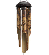 Nalulu Rustic Bamboo Wind Chimes outdoors with floral burned design and coconut crown for calming ambiance