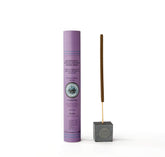 Nantucket Spider Mosquito Sticks lit outdoors with meadow scent to deter pests on a patio.