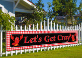 Nepnuser crawfish banner on fence for outdoor party decor, enhancing ambiance.