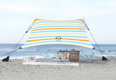 Neso portable beach tent with sand anchor provides stable shade on sunny beaches.