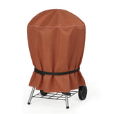 NettyPro grill cover fadeproof fabric shields the 22-inch kettle from sun and rain.