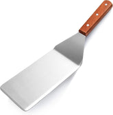 New Star Foodservice 36350 wood-handle grill turner with cutting edge for precise flipping.