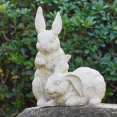 Newman House Studio nestled bunny cream garden statue for outdoor decor.